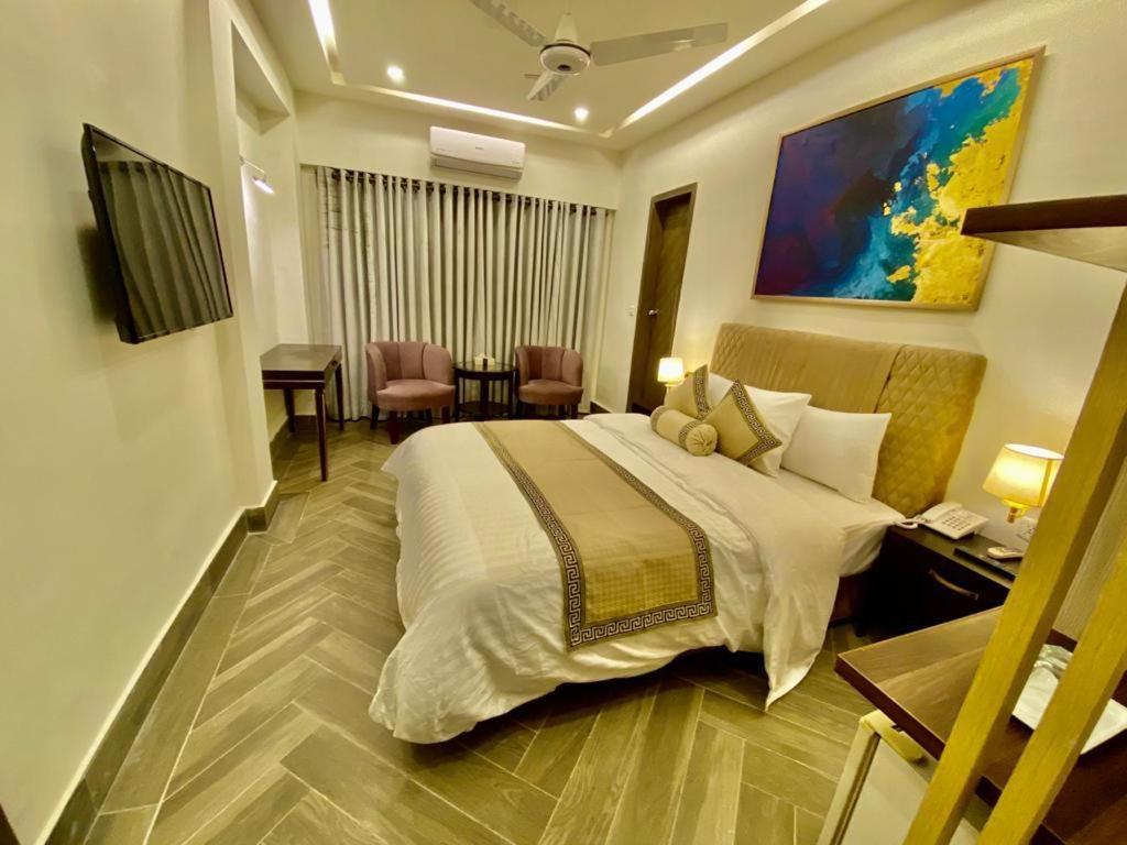 Shelton Hotel Mardan Bagian luar foto